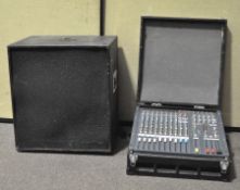 A group of music equipment comprising an Allen & Heath PA12-CP power mixer and a large speaker,