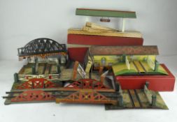 A Hornby 0 Gauge railway station, together with bridges by Mettoy & Hornby
