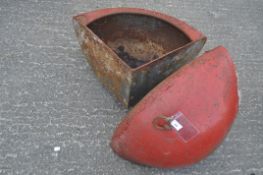 Two red painted metal animal feeders, of D-section,