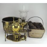 A group of brassware, including a kettle, jardiniere, trivet, oil lamp,