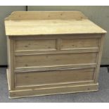 A large pine trunk with gallery back, hinged lid and fixed 'drawer' fronts,
