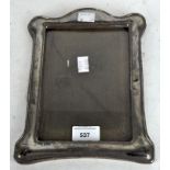 A Cohen & Charles silver covered photo frame, hallmarked Birmingham 1918,