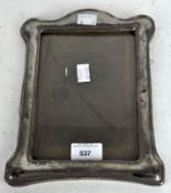 A Cohen & Charles silver covered photo frame, hallmarked Birmingham 1918,