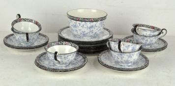 A Royal Doulton tea service, circa 1910, printed green marks, printed with floral decoration,