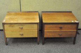A pair of mid century teak bedside chests of drawers, each with two drawers,