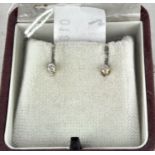 A boxed pair of 9ct gold diamond solitaire stud earrings