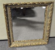 A large gilt wood and gesso framed wall mirror of rectangular section, 20th century,