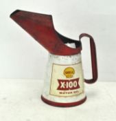 A Shell X-100 Motor Oil can