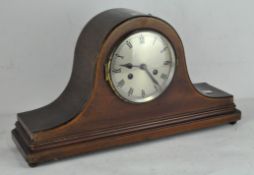 An Edwardian mahogany Napoleon hat mantel clock, silvered dial with Roman numerals, with pendulum,
