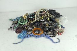 An extensive collection of assorted costume jewellery, comprising bracelets,