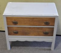 A small grey painted chest of drawers with two long drawers,