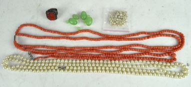 A selection of costume jewellery, including two coral necklaces and a Chinese ring
