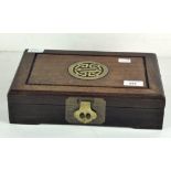 A Chinese vintage hardwood jewellery box with brass fittings and central good luck symbol to lid,