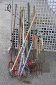 A large selection of vintage tools, mostly garden related, including forks,