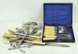 A boxed set of silver plated fish knives and fork with bakelite handles,