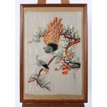 An Eastern silk work picture of peacocks in pine branches, 67 cm x 46 cm,