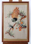 An Eastern silk work picture of peacocks in pine branches, 67 cm x 46 cm,