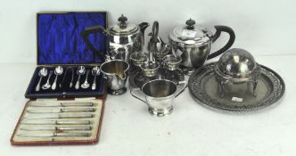 A collection of silver plate, comprising teapots, jugs,