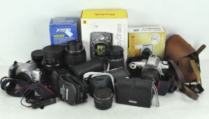 A selection of assorted cameras and lenses including a mid-century Kodak Brownie Cresta 3 camera,