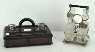 An early 20th century dual inkwell/pen stand with two glass inkwells and two pen recesses