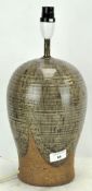 A Studio pottery stoneware lamp base, glazed with stylised decoration,