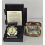 A Dalvey travel clock with a black leather case, in the original box with documents,