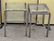 Two square glass side tables, with metal frames,