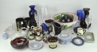 A large quantity of glass and ceramics, comprising jugs, plates and bowls,