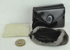 A selection of vintage items, including two handbags, a fur mounted ladies hat,