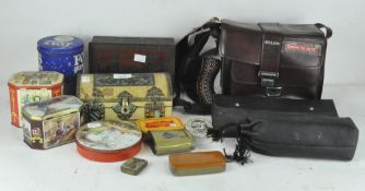 A Helios camera and fittings, within a leather carry case, with another lens,