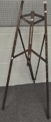 A late 19th/early 20th century oak standing easel stamped HATHERLEY EASEL PATENT, of folding design,