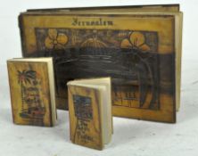 A 1917 Olive wood pressed flower album and two olive wood miniature books