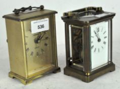 A 20th century carriage clock, white dial with Roman numerals, in a brass case with glass panels,
