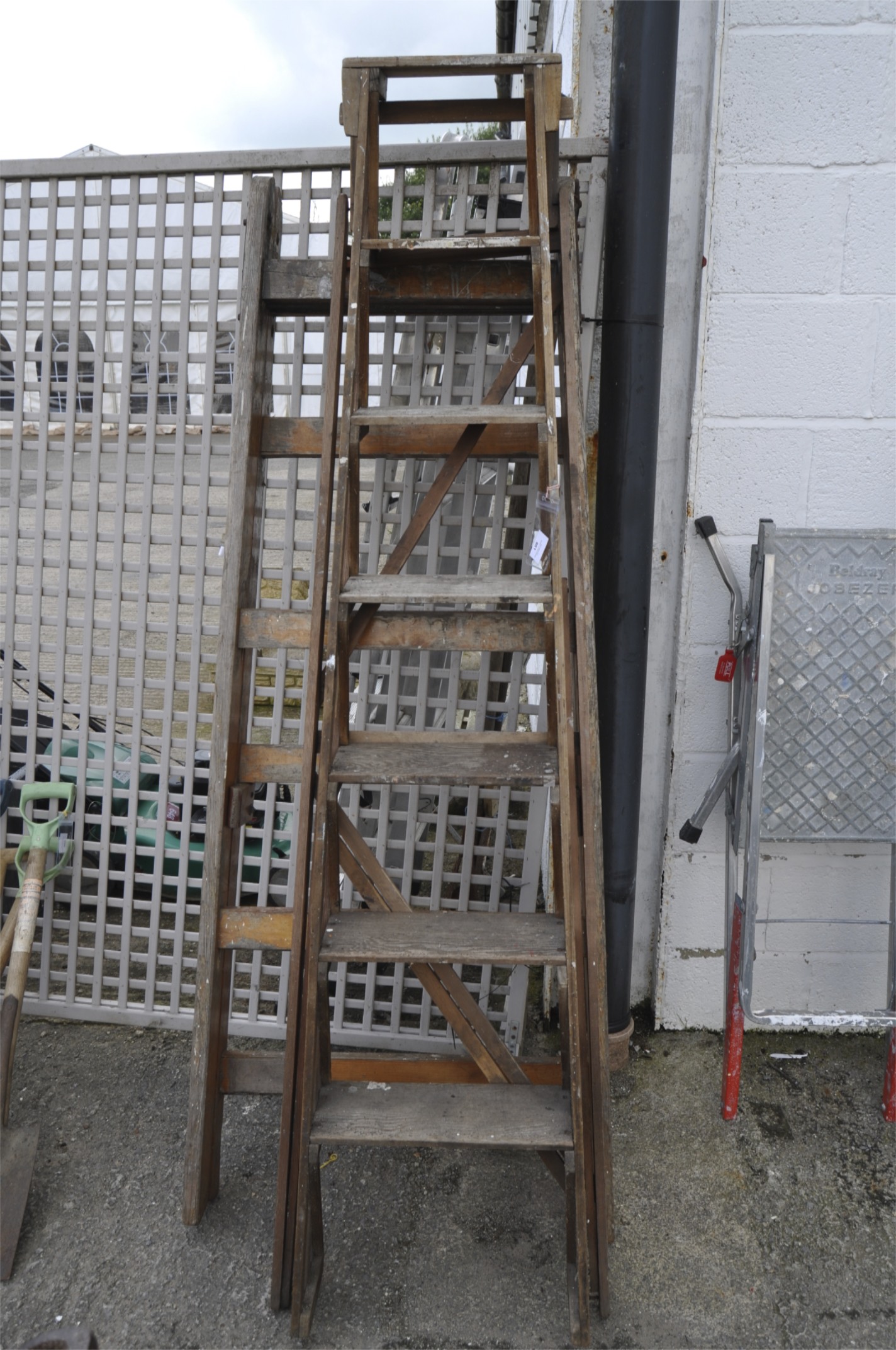 Two vintage wooden step ladders, one marked Eclipse, for C& E Hospital,