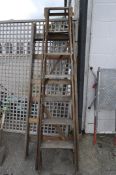 Two vintage wooden step ladders, one marked Eclipse, for C& E Hospital,