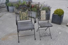 Two metal folding garden chairs, each with bamboo design to back,