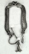 A white metal Albert chain,