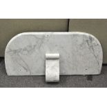 A bevelled white and grey-flecked marble washstand top and scroll candle shelf,