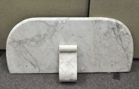 A bevelled white and grey-flecked marble washstand top and scroll candle shelf,