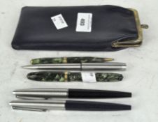 Five vintage pens, including a Conway Stewart fountain pen,