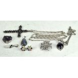 A small selection of costume jewellery including two silver mounted pendants,