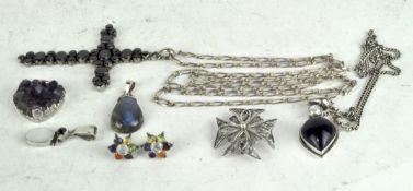 A small selection of costume jewellery including two silver mounted pendants,