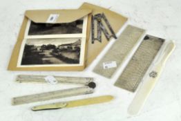 A selection of early 20th century ivory and bone measuring rulers and a letter opener,