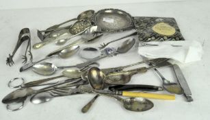 A collection of silver plated flatware, comprising cutlery, penknives, scissors and more,