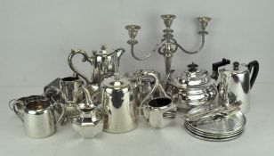 A large collection of silver plated wares including tea sets jugs,