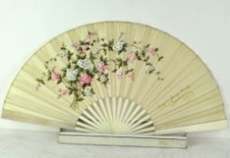 A 19th century folding fan commissioned to celebrate a marriage, bone guards and sticks,