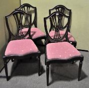A set of four mahogany shield back chairs with pink upholstery