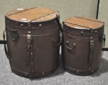 A set of two vintage Chinese drum form wood lined and leather bound boxes and covers,