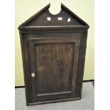 A Victorian oak corner cupboard,