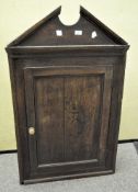 A Victorian oak corner cupboard,